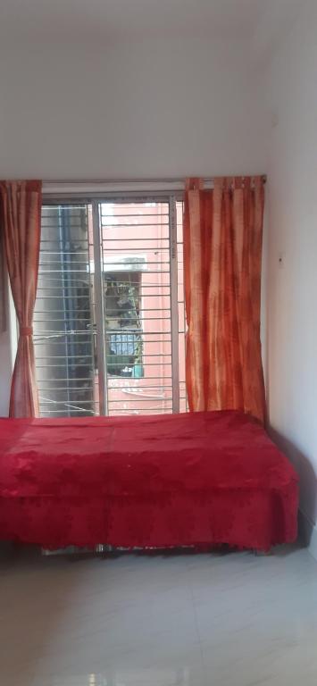 Postel nebo postele na pokoji v ubytování Sakshi Home Stay