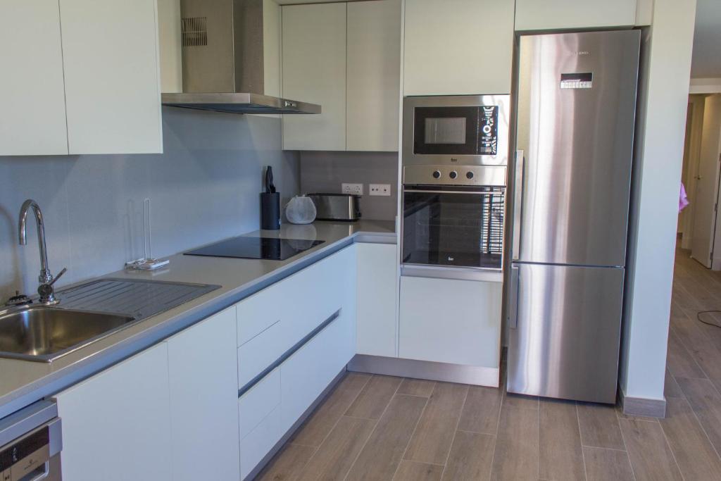 Kuchyň nebo kuchyňský kout v ubytování Apartamento ático Golden Star