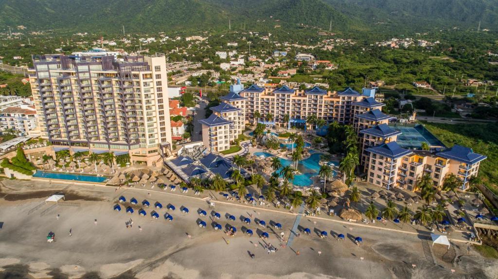 a large city with a lot of palm trees at Zuana Beach Resort in Santa Marta
