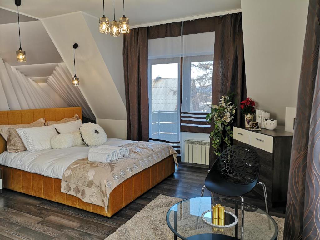 Posteľ alebo postele v izbe v ubytovaní ApartPodhale