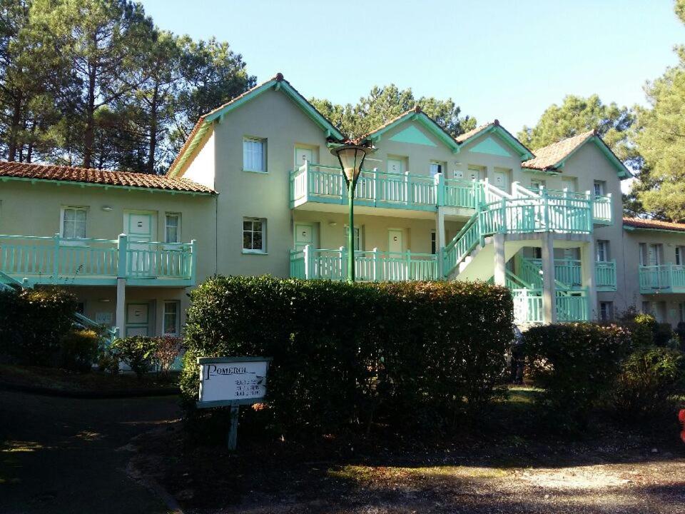 a large building with a sign in front of it at Lacanau golf in Lacanau