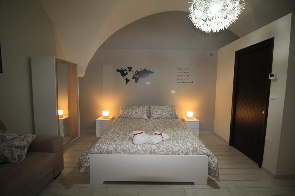A bed or beds in a room at Guest House Orsini