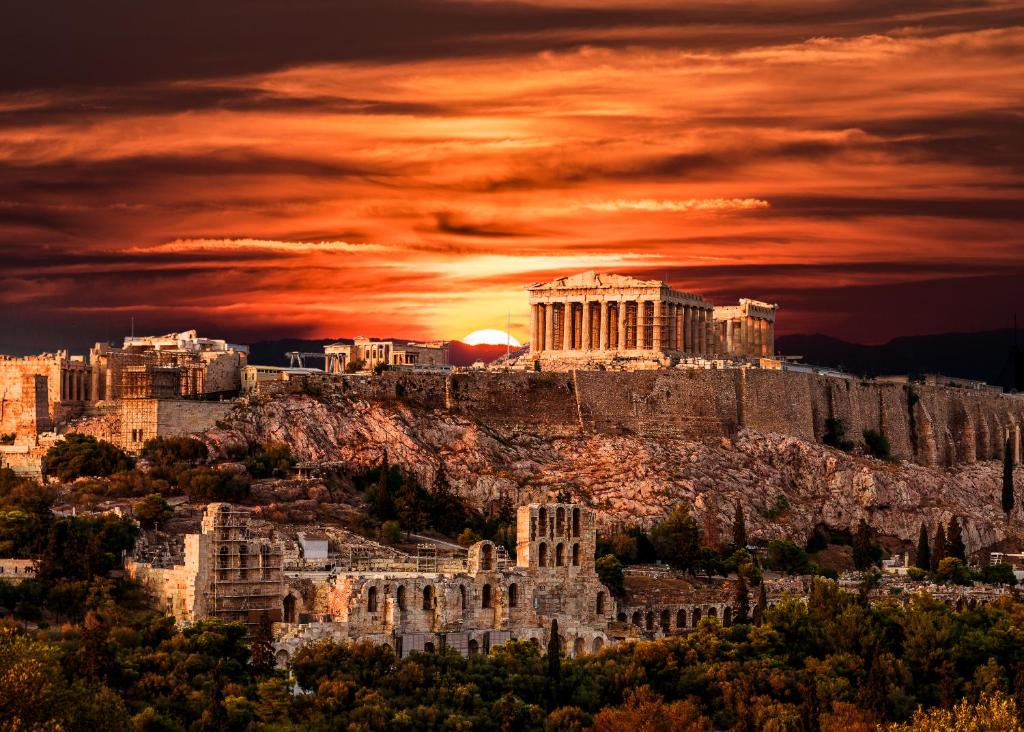 a view of the acropolis of athens at sunset at A.P. Acropolis View Apartments in Athens