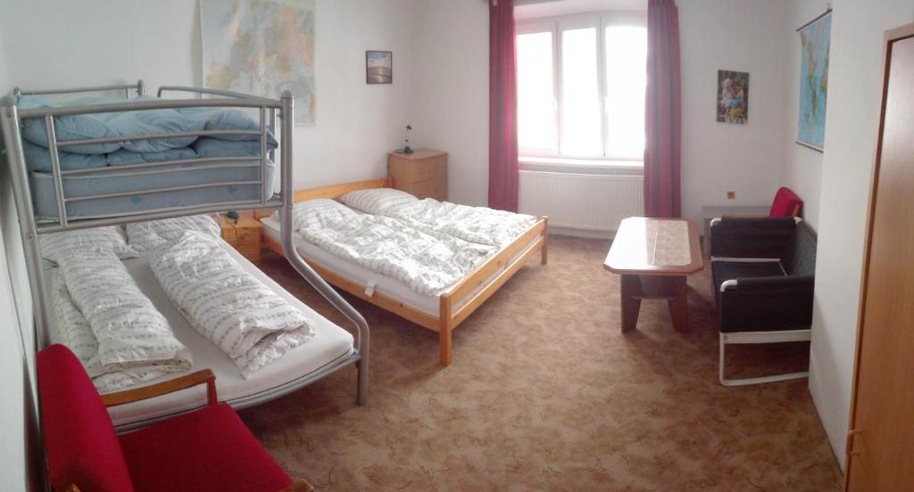 Łóżko lub łóżka w pokoju w obiekcie Apartmán Saxán Smržovka