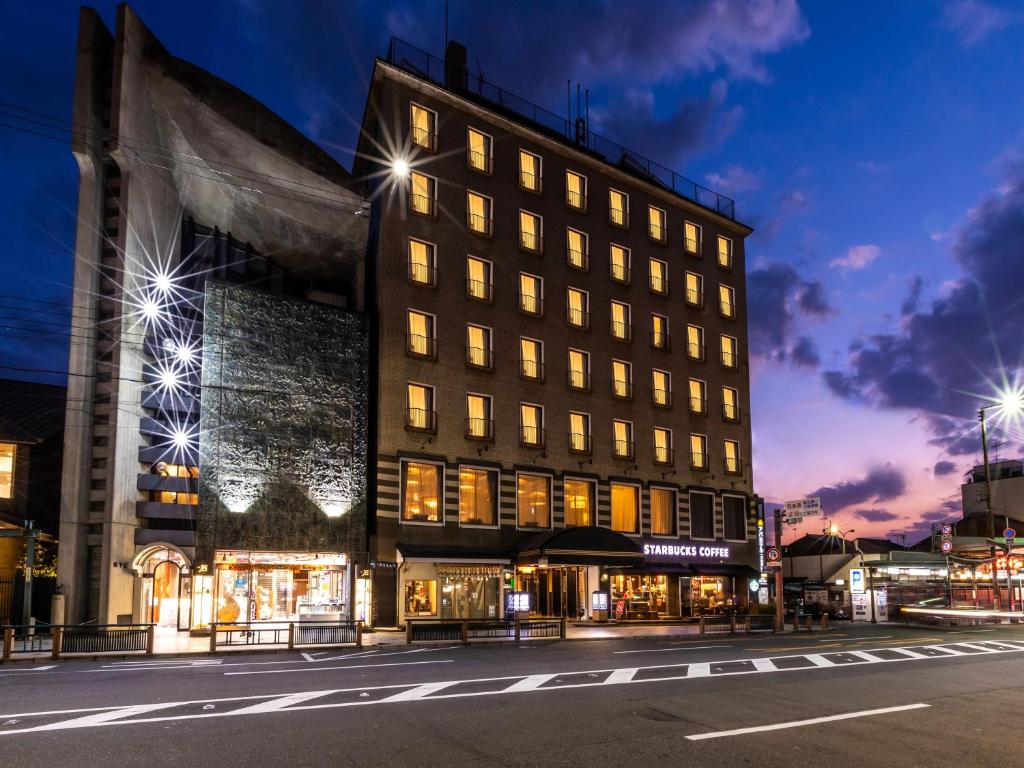 a building on a city street at night at APA Hotel Kyoto Gion Excellent in Kyoto