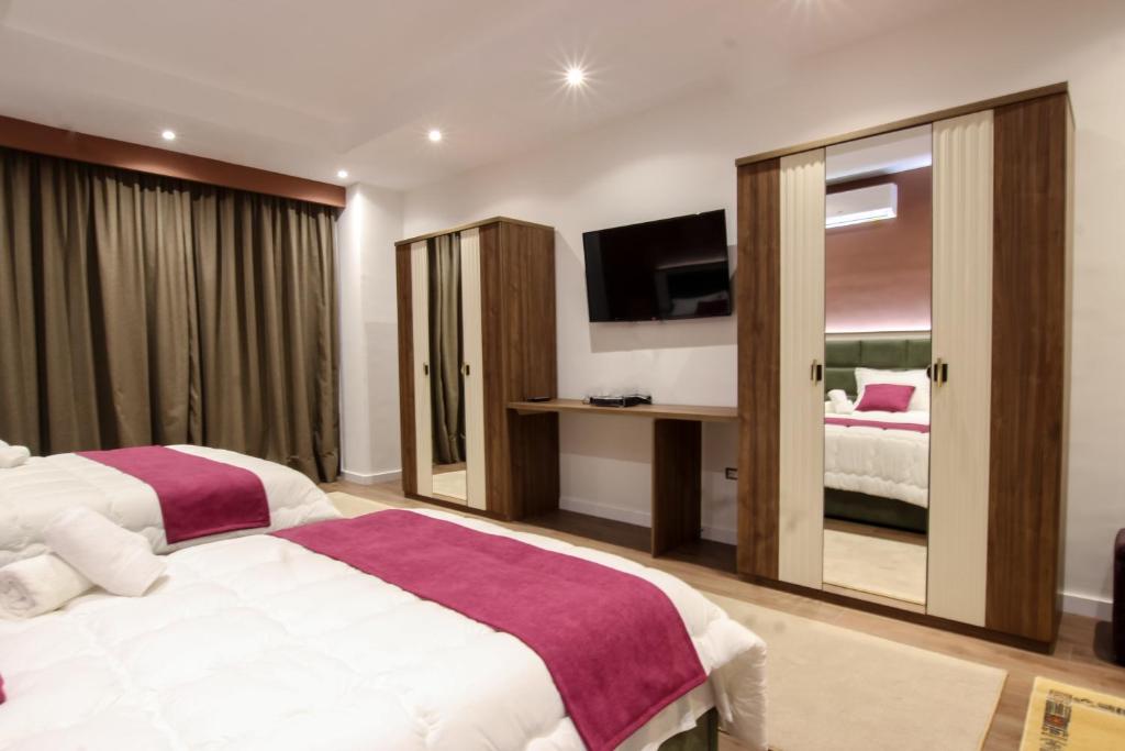 Postel nebo postele na pokoji v ubytování Hotel Vasho