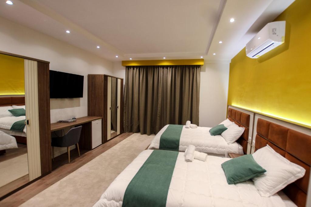 Postel nebo postele na pokoji v ubytování Hotel Vasho