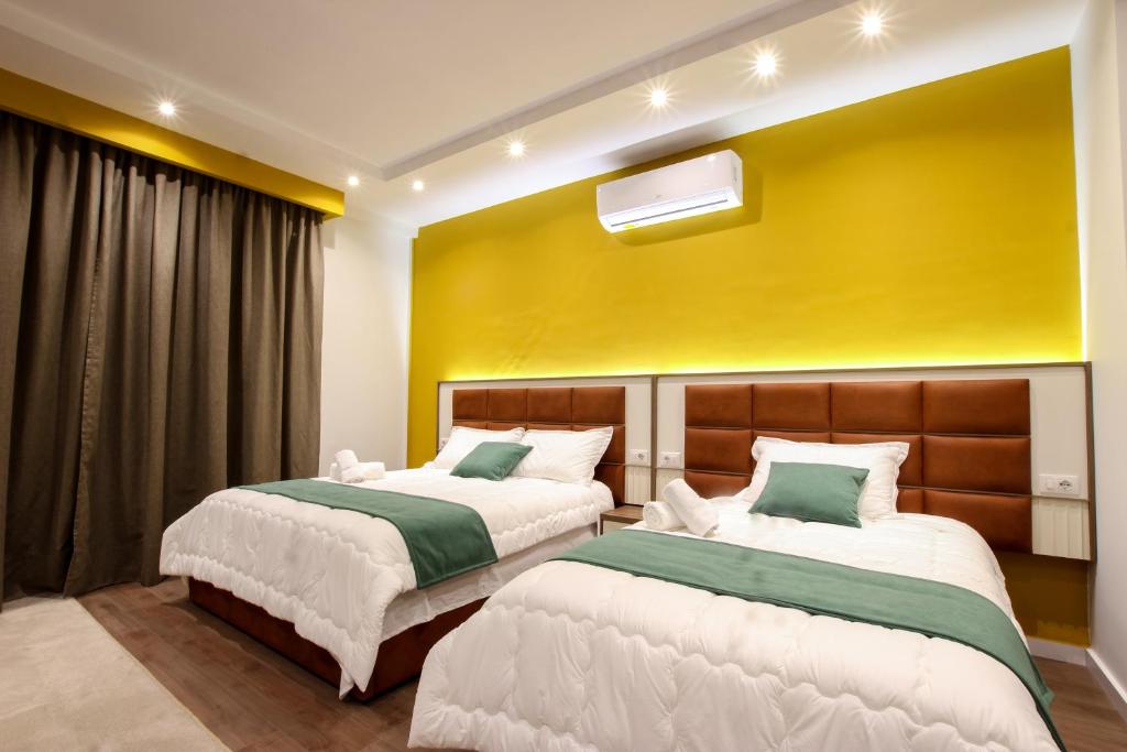 Postel nebo postele na pokoji v ubytování Hotel Vasho