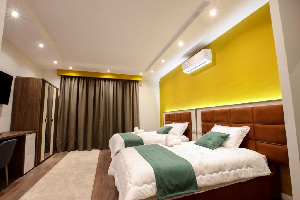 Postel nebo postele na pokoji v ubytování Hotel Vasho