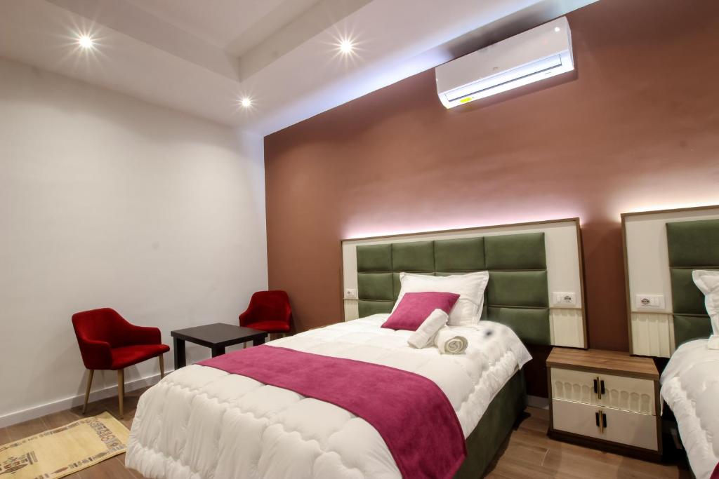 Postel nebo postele na pokoji v ubytování Hotel Vasho