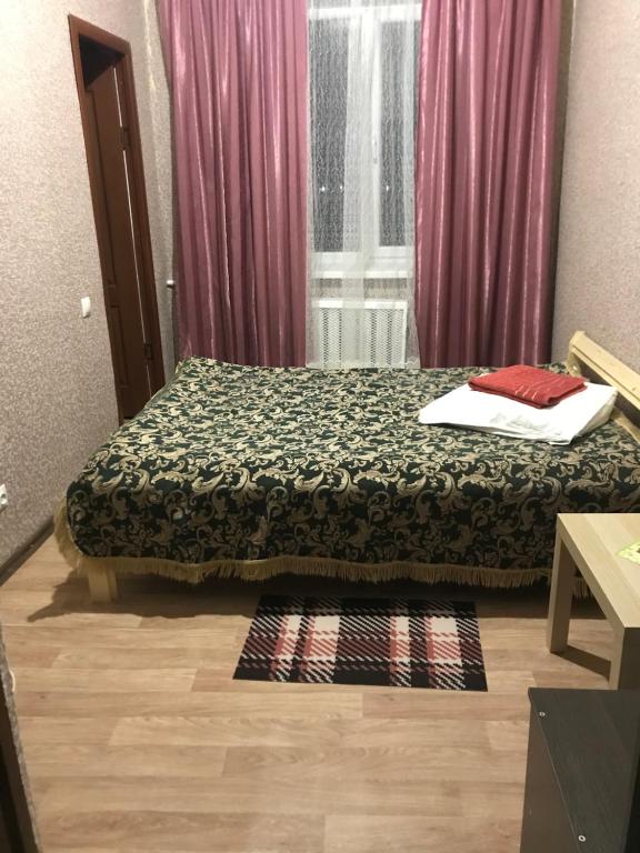 Кровать или кровати в номере Central'naya