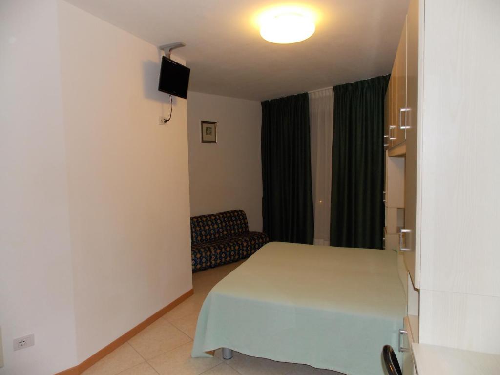 Postel nebo postele na pokoji v ubytování Hotel Colorado