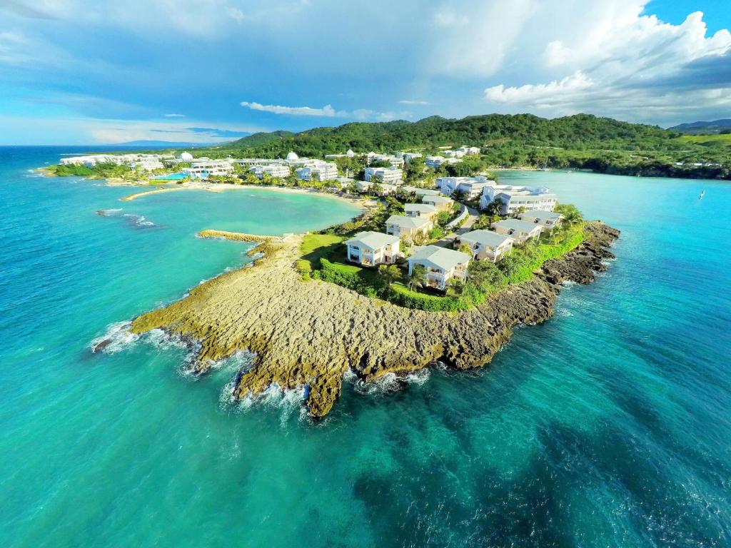 an island in the ocean with houses on it at Grand Palladium Lady Hamilton Resort & Spa - All Inclusive in Lucea