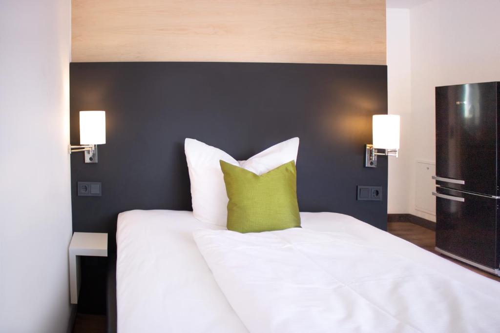 Postel nebo postele na pokoji v ubytování KF Hotel by WMM Hotels