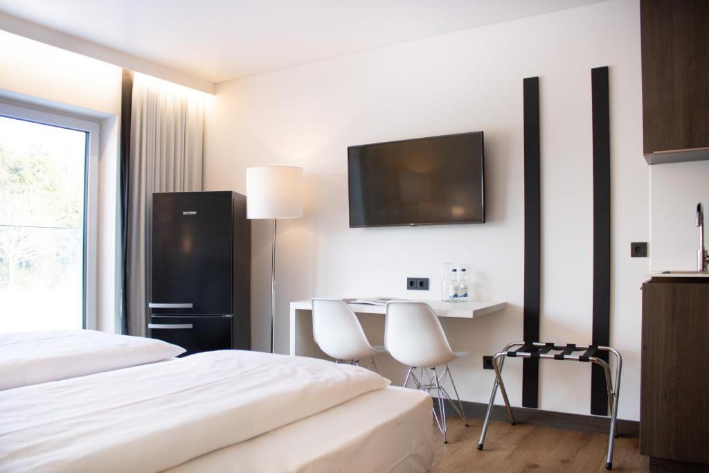 Kuchyň nebo kuchyňský kout v ubytování KF Hotel by WMM Hotels