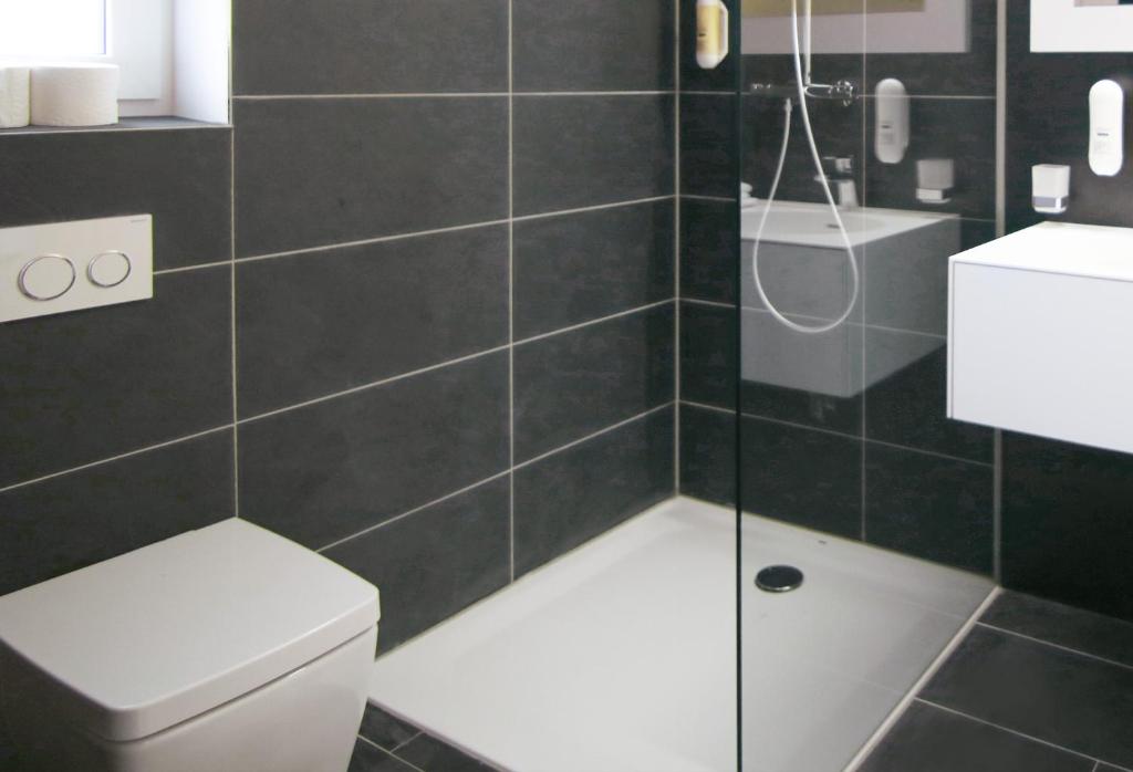 Koupelna v ubytování KF Hotel by WMM Hotels