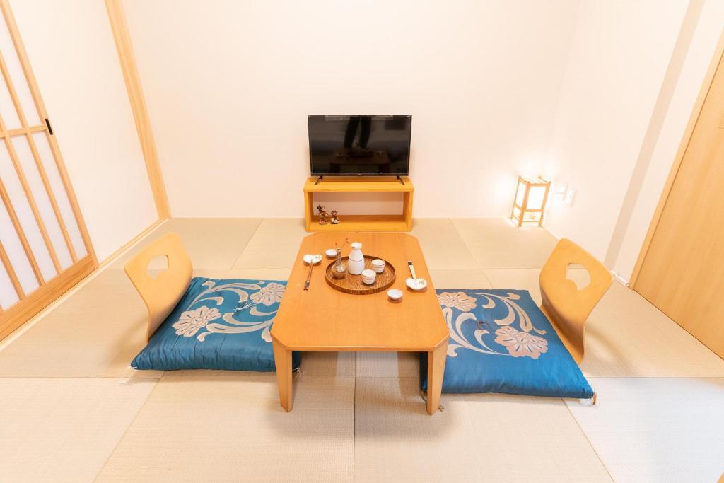 TV a/nebo společenská místnost v ubytování 大吉屋 ワンフロア貸切旅館名古屋駅圏内