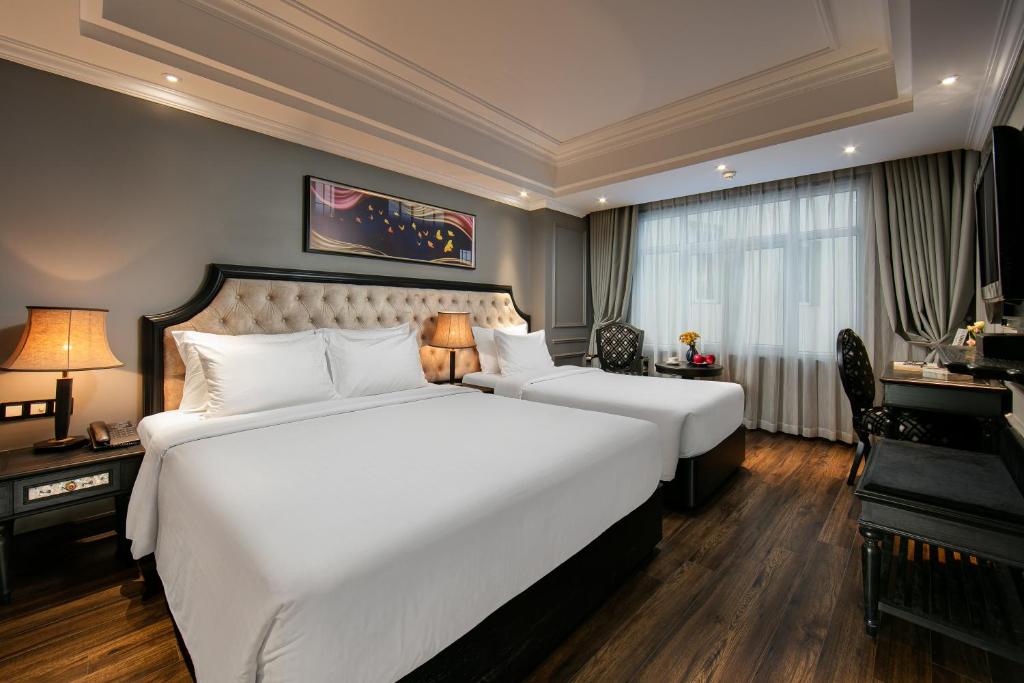 Postel nebo postele na pokoji v ubytování Scent Premium Hotel