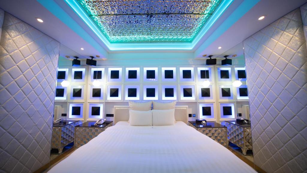 Postel nebo postele na pokoji v ubytování I-more Motel