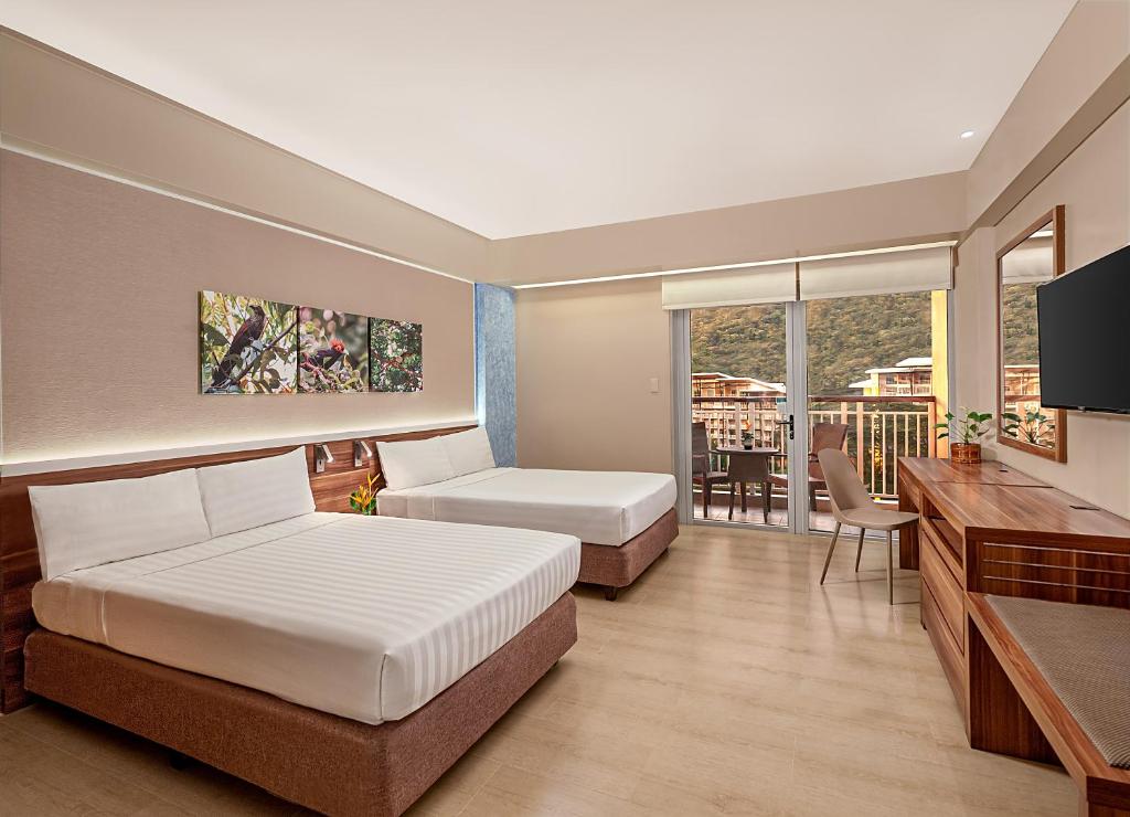 Postel nebo postele na pokoji v ubytování Pico Sands Hotel