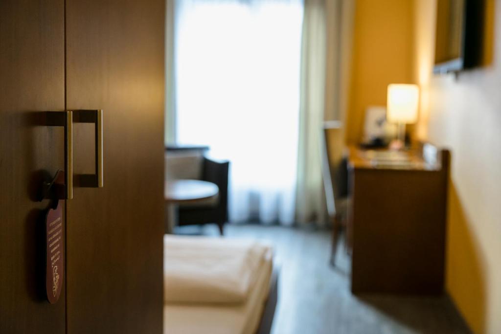 Postel nebo postele na pokoji v ubytování Montfort - das Hotel
