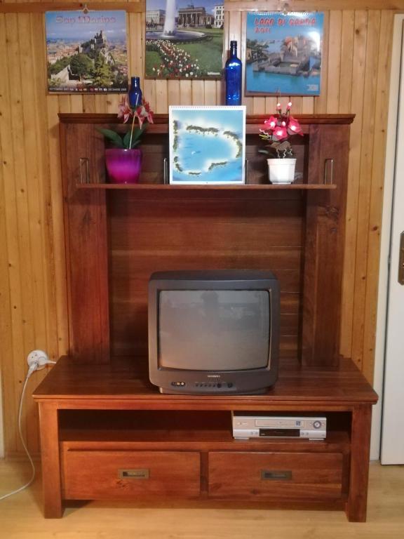 Televízia a/alebo spoločenská miestnosť v ubytovaní SUNSHINE house
