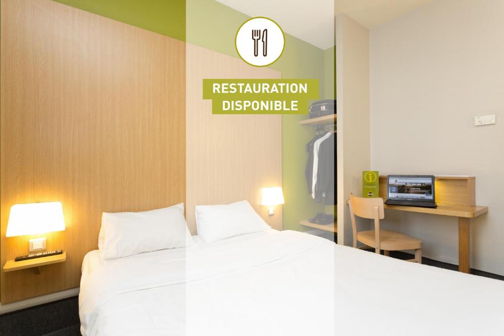 Postel nebo postele na pokoji v ubytování B&B HOTEL Quimper Sud Bénodet