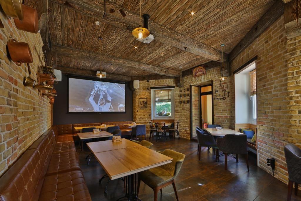 TV a/nebo společenská místnost v ubytování Hotel Barbaris