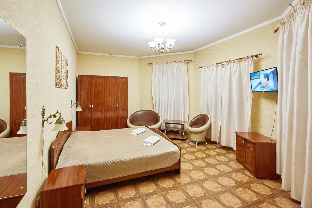 TV a/nebo společenská místnost v ubytování Hotel Barbaris