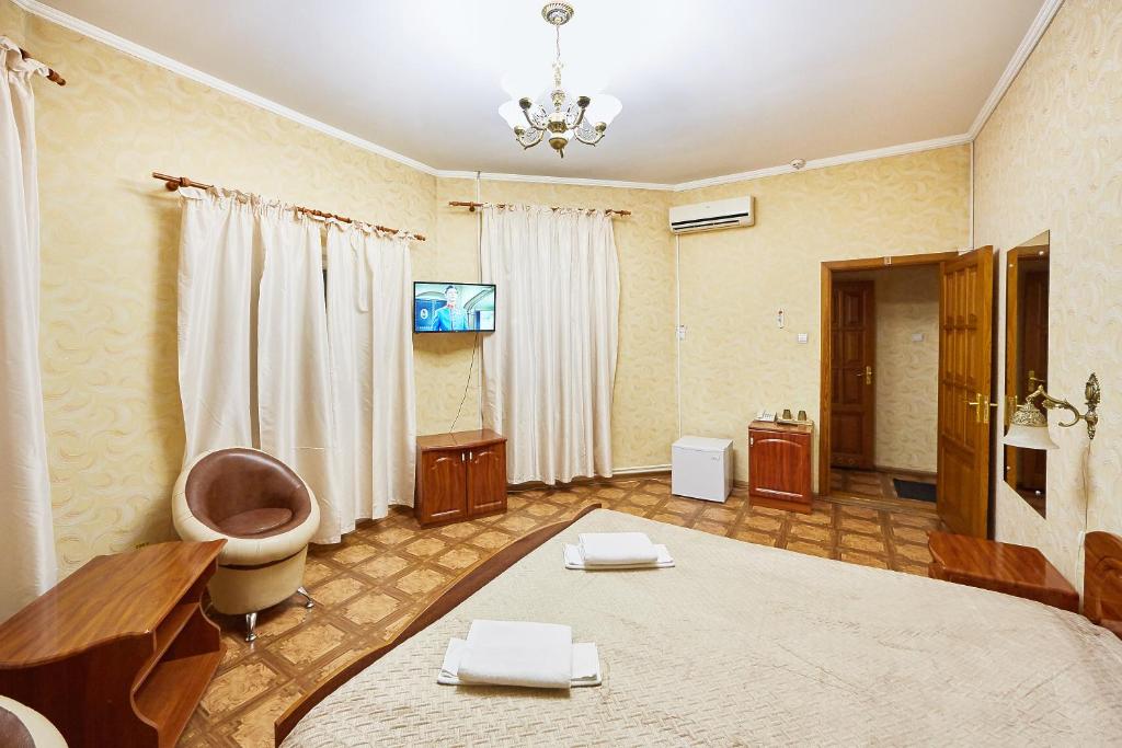 TV a/nebo společenská místnost v ubytování Hotel Barbaris