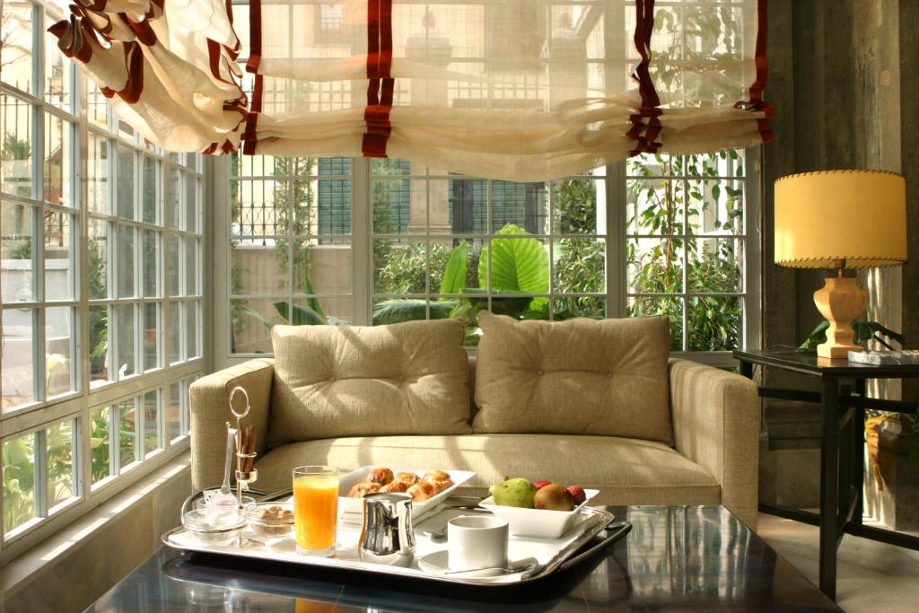 a living room with a tray of food on a table at Villa Oniria in Granada