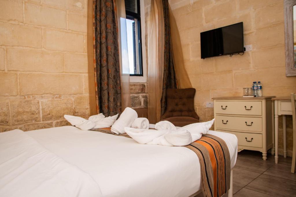 Łóżko lub łóżka w pokoju w obiekcie Point de vue Guesthouse