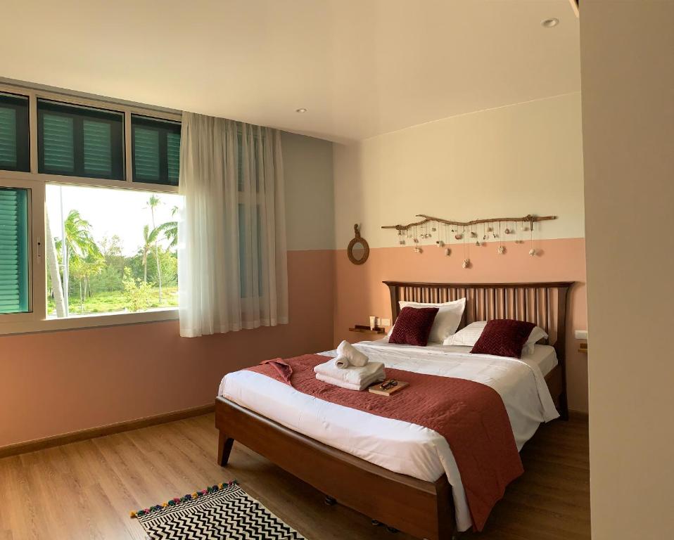 Giường trong phòng chung tại Phu Quoc Villa Casa Fish