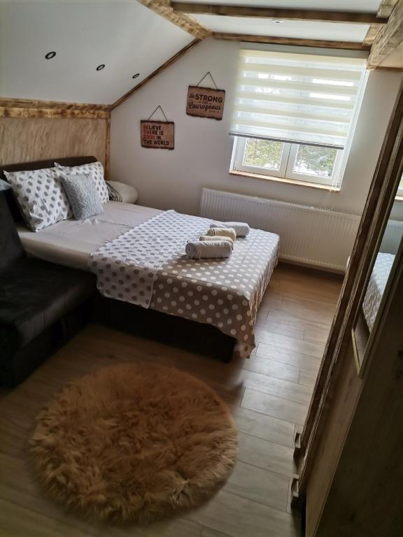 Postel nebo postele na pokoji v ubytování Apartmani MILOSAVLJEVIĆ Divčibare