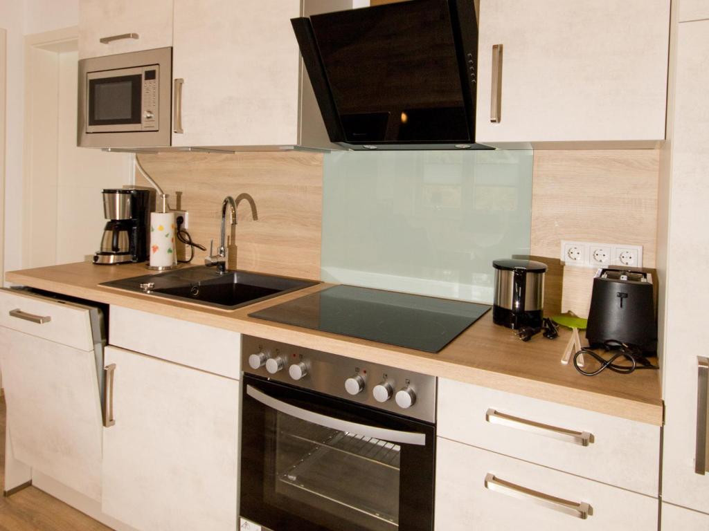 Kuchyň nebo kuchyňský kout v ubytování Ferienwohnung Stratmann