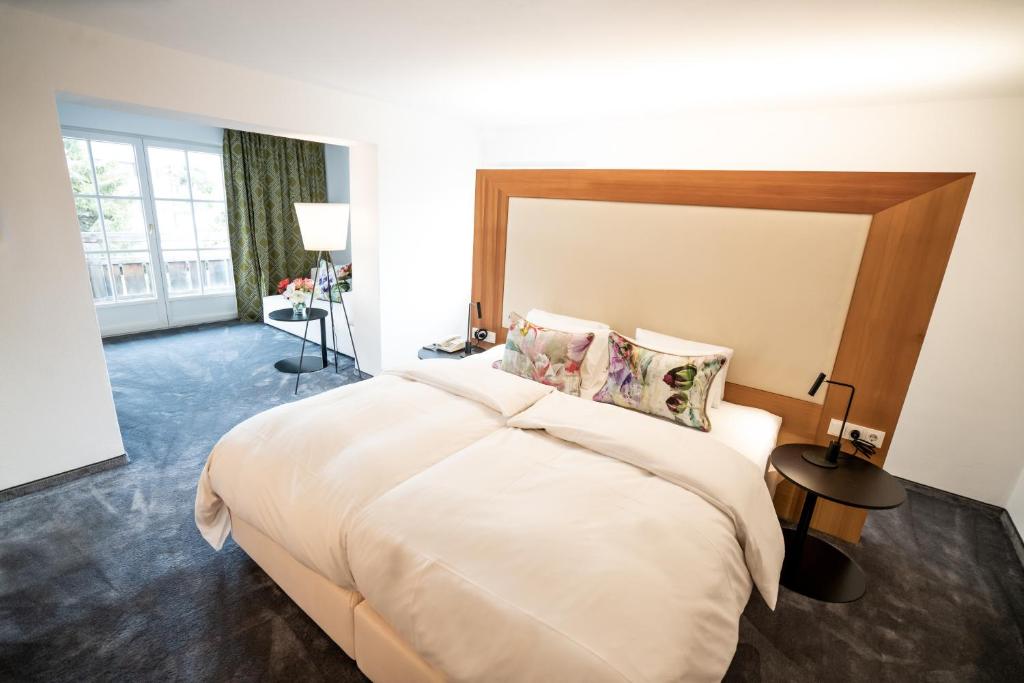 Postel nebo postele na pokoji v ubytování Hotel Christina