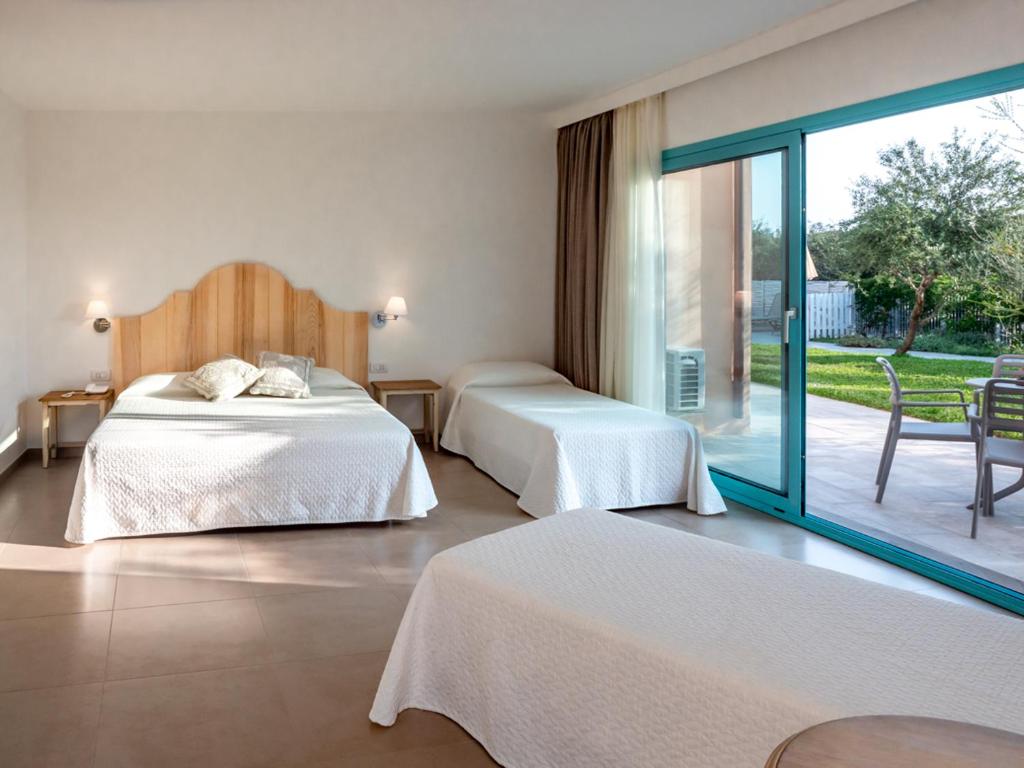 Postel nebo postele na pokoji v ubytování Park Hotel Asinara