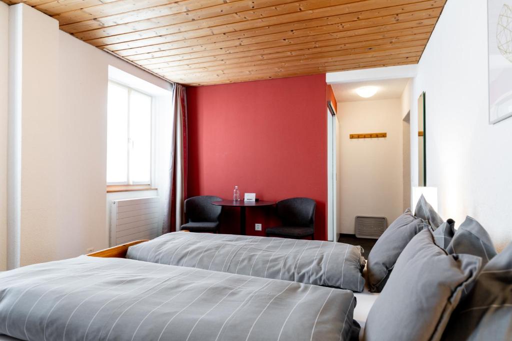 Postel nebo postele na pokoji v ubytování Hotel Bellevue