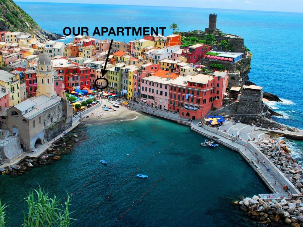 an aerial view of a city next to the water at MADA Charm Apartments Piazza in Vernazza