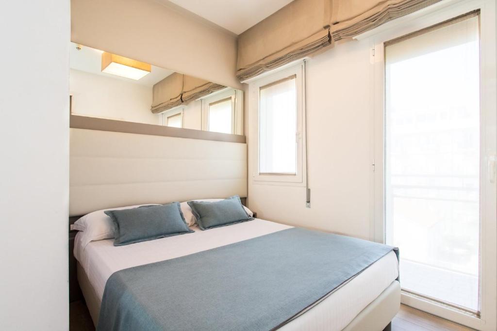 Postel nebo postele na pokoji v ubytování Hotel Delle Mimose