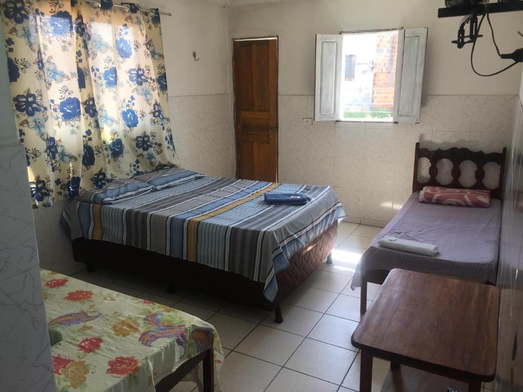 Cama ou camas em um quarto em Pousada da Serra