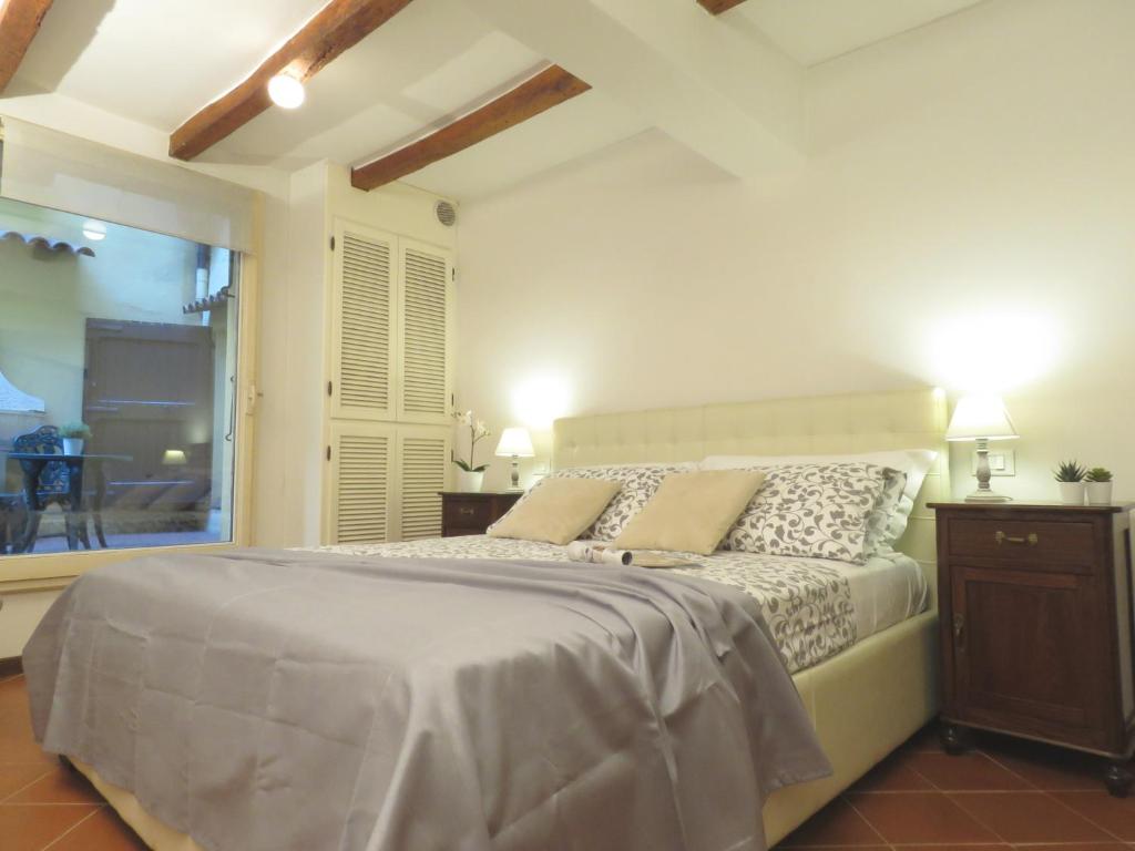 Säng eller sängar i ett rum på Cesare Battisti Apartment