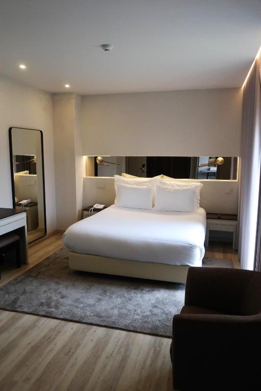 Кровать или кровати в номере Hotel Cristal Setúbal