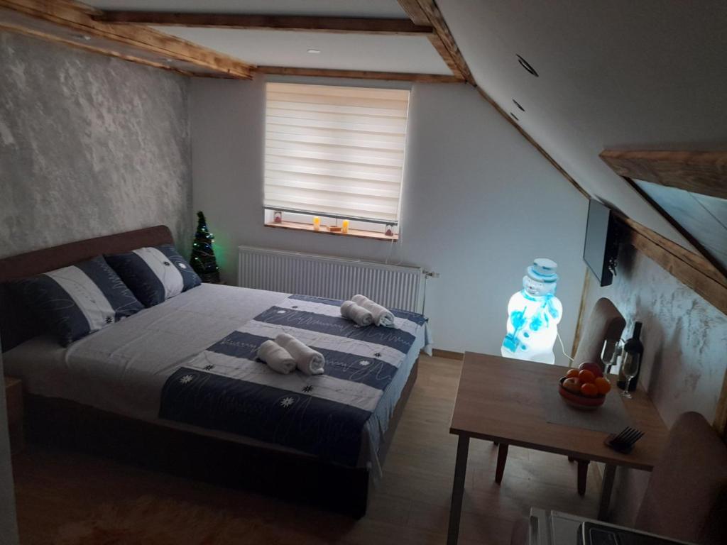 Postel nebo postele na pokoji v ubytování Apartmani MILOSAVLJEVIĆ Divčibare