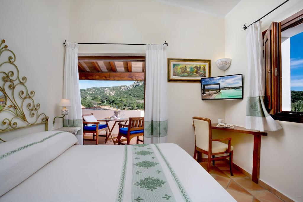Postel nebo postele na pokoji v ubytování Felix Hotels - Country Resort Parco degli Ulivi
