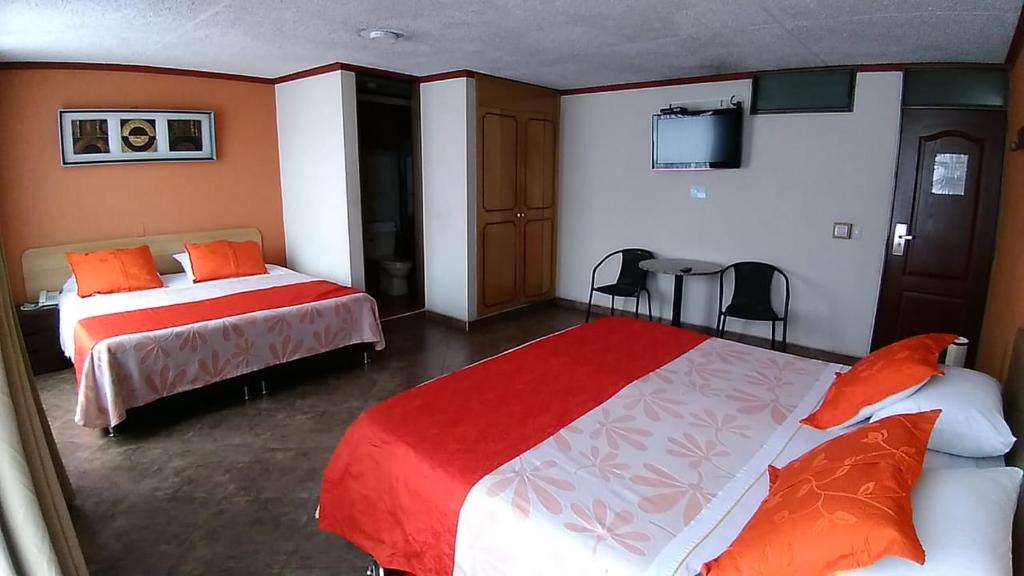 Postel nebo postele na pokoji v ubytování Hoteles Bogotá Inn Galerías