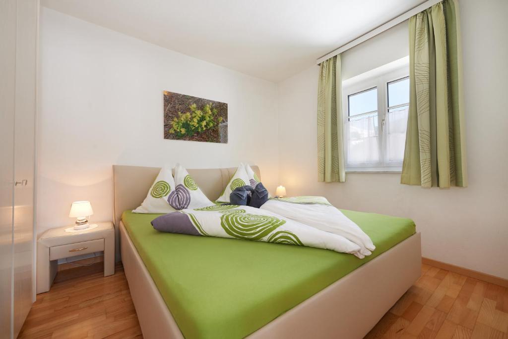 Postel nebo postele na pokoji v ubytování Apartments Geistlinger