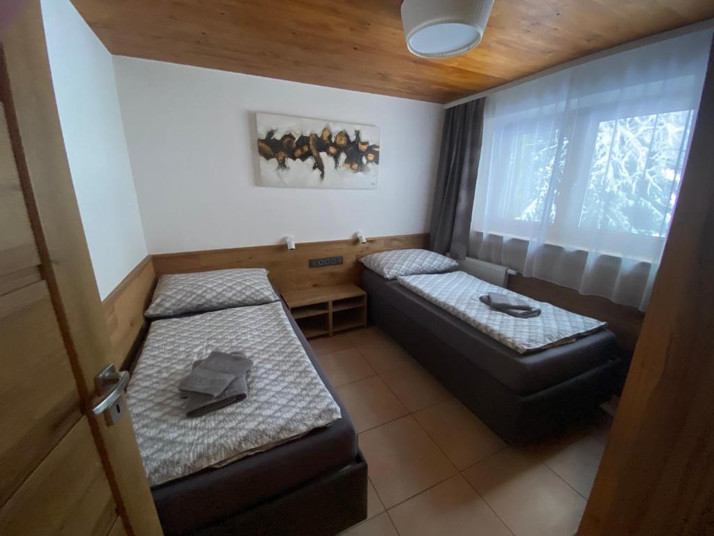 Postel nebo postele na pokoji v ubytování Pension Marina