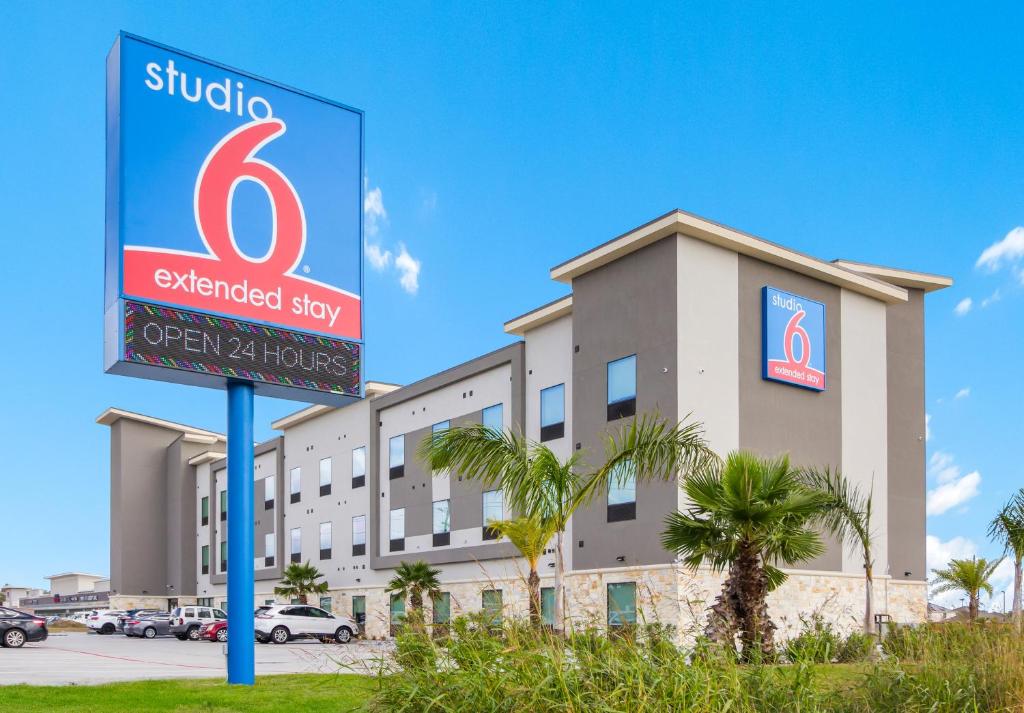 a hotel sign in front of a building at Studio 6 Katy, Tx in Katy