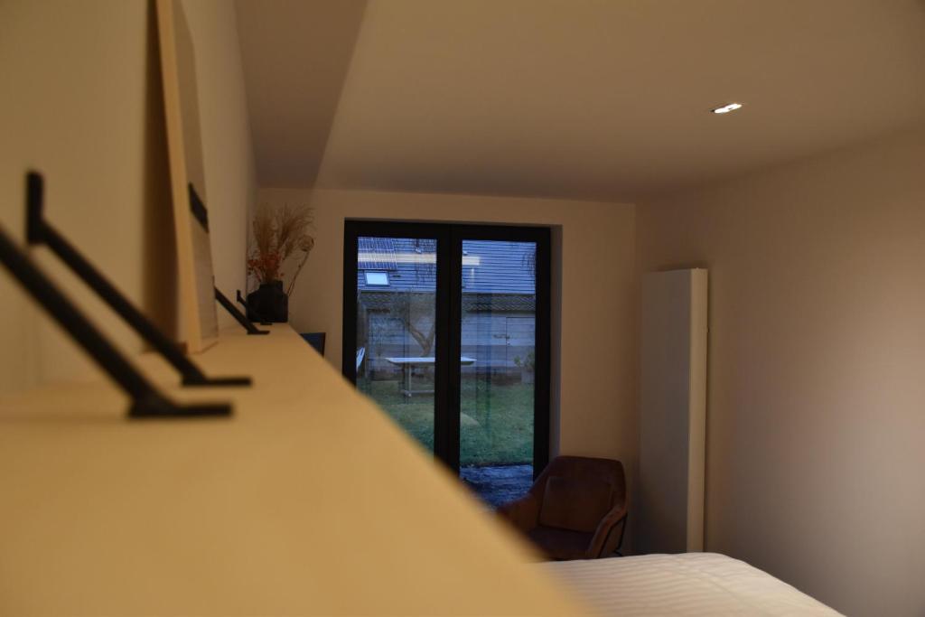 Postel nebo postele na pokoji v ubytování Poutrelle Guestrooms